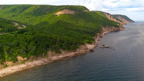 Green headlands meeting the Atlantic along the Cabot Trail.