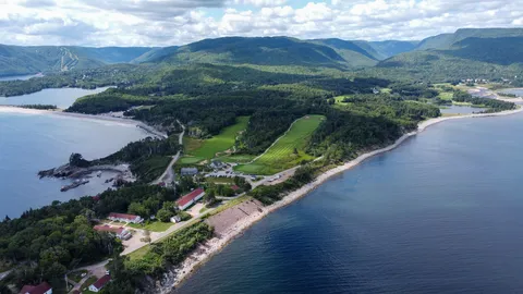 The lodge and golf holes along a rocky Atlantic shoreline.