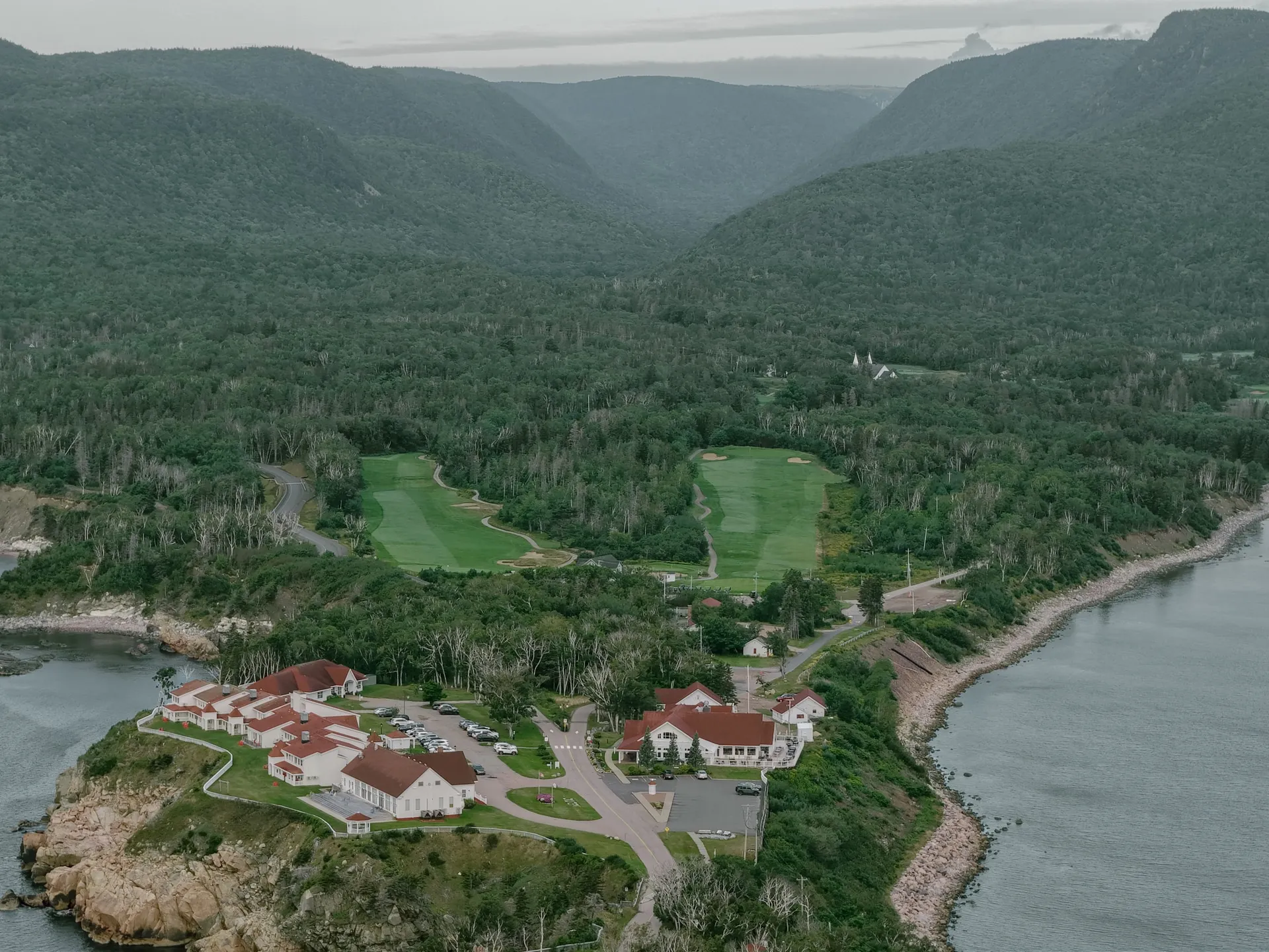 Aerial view of The Keltic Resort and Highlands Links fairways along the Cape Breton coast